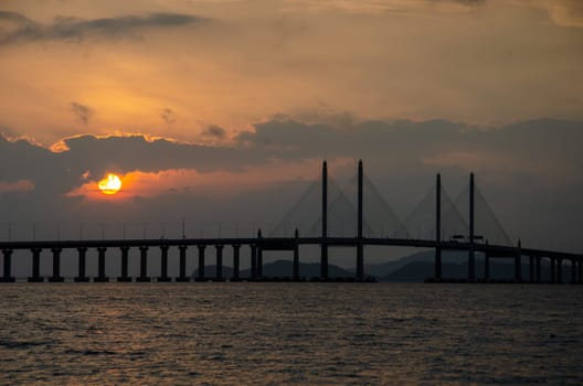 Georgetown, Penang/Malaysia - Mar 28 2018: Egg yolk sunrise at Penang Second Bridge.