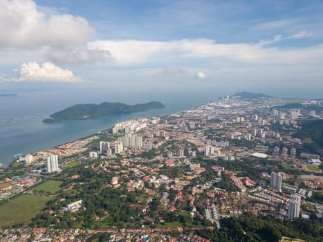 Georgetown, Penang/Malaysia - Jun 08 2019: Aerial view Sungai Dua town in blue cloud morning.