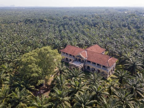 Nibong Tebal, Penang/Malaysia - Jun 27 2019: Aerial view abandoned 99 doors mansion in evening.