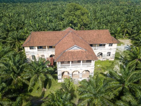 Nibong Tebal, Penang/Malaysia - Jun 27 2019: Aerial view 99 doors mansion at oil palm estate.