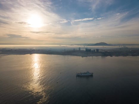 George Town, Penang/Malaysia - Jul 17 2019: Aerial view ship sail at sea. Background is Seberang Perai.