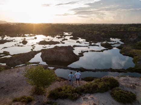 Bukit Mertajam, Penang/Malaysia - Jul 15 2019: Two people enjoy the magnificent view of lake at Guar Petai during sunset.