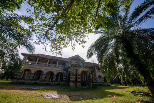Nibong Tebal, Penang/Malaysia - Jun 28 2019: Colonial building 99 door mansion in oil palm estate.