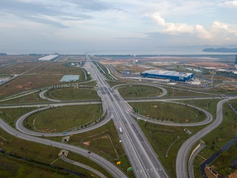 Batu Kawan, Penang/Malaysia - Aug 27 2019: Freeway cloverleaf interchange at Batu Kawan. IKEA building as background.