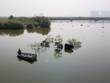 Batu Kawan, Penang/Malaysia - Sep 24 2019: Fisherman relax on boat.