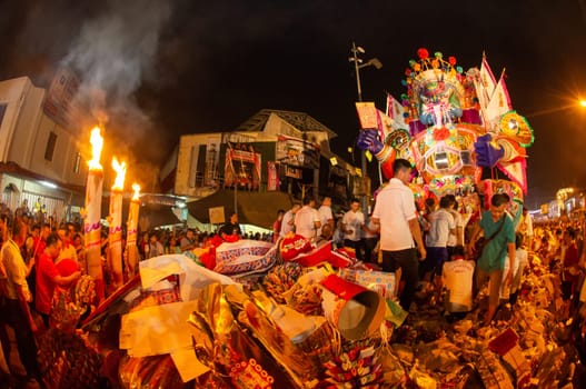 Bukit Mertajam, Penang/Malaysia - Aug 17 2019: People put statue ghost king on joss paper to be burnt together.