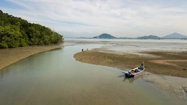 Pulau Aman, Penang/Malaysia - Oct 19 2019: A boat park near coastal at Pulau Aman.