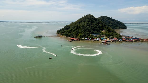 Pulau Aman, Penang/Malaysia - Oct 19 2019: Aerial fishing boat move at Pulau Aman.