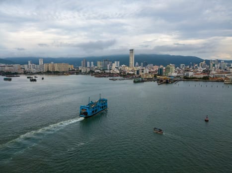 George Town, Penang/Malaysia - Oct 23 2019: Blue ferry arrive Penang island.