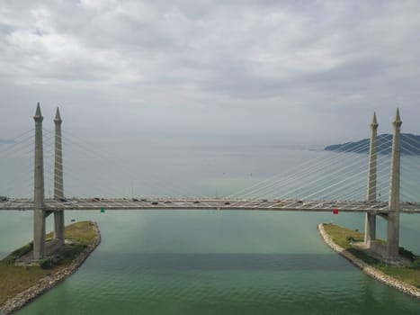 George Town, Penang/Malaysia - Oct 24 2019: Aerial view traffic at Penang Bridge in cloudy morning.