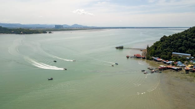 Pulau Aman, Penang/Malaysia - Oct 19 2019: Fishing boat move at fishing farm near Pulau Aman.