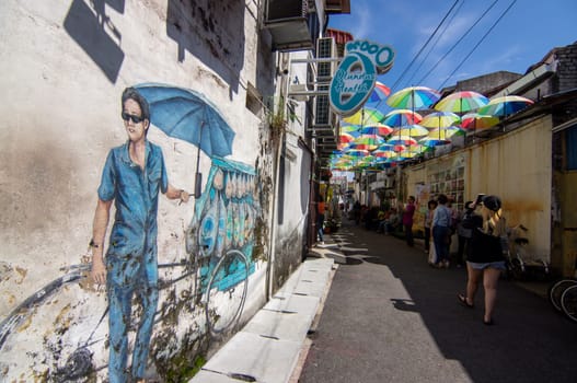 George Town, Penang/Malaysia - Nov 11 2019: Street art with mural a man sell bread near Armenian Street.