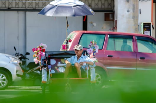 Georgetown, Penang/Malaysia - Jan 03 2020: Rickshaw driver wait for passenger.