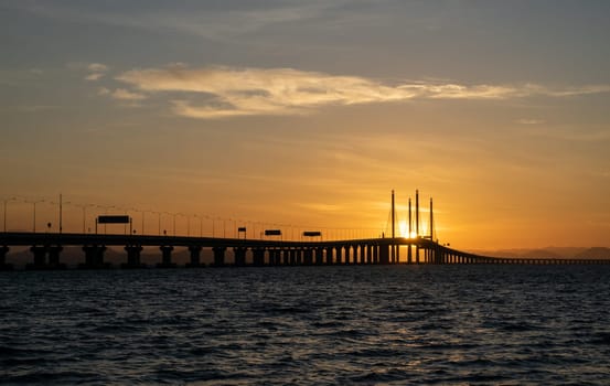 Batu Maung, Penang/Malaysia - Jan 01 2020: Penang second bridge in golden sun flare.