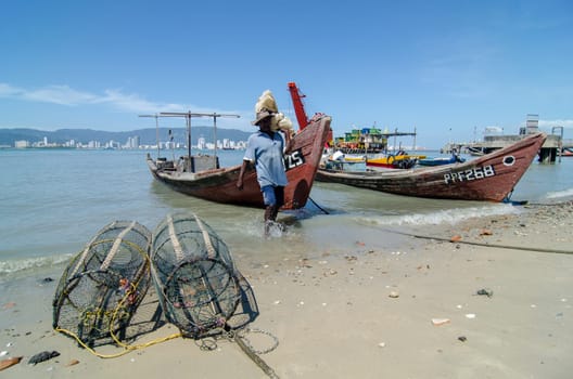 Butterworth, Penang/Malaysia - Jan 01 2020: Fisherman work near coastal.