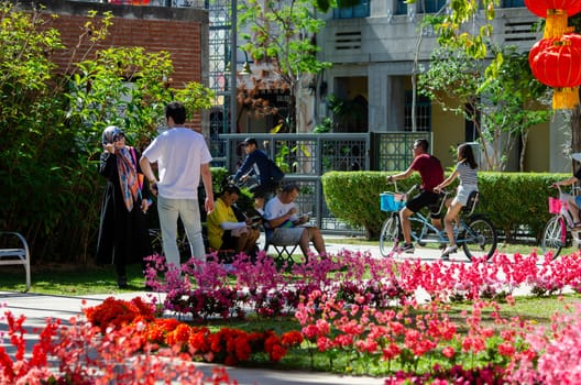 Georgetown, Penang/Malaysia - Jan 03 2020: People drawing, cycling, talk to each other at park.