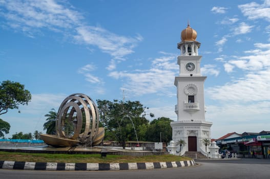 Georgetown, Penang/Malaysia - Feb 14 2020: Queen Victoria Memorial clock tower with fountain under blue sunny day.