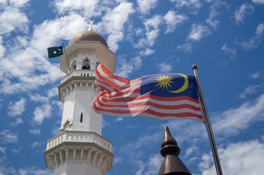 Georgetown, Penang/Malaysia - Feb 14 2020: Malaysia flag wave at Kapitan Keling Mosque
