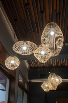 Handmade wicker lampshade decorated in lobby, stock photo