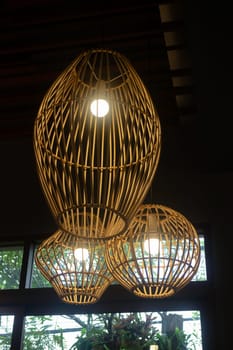 Handmade wicker lampshade decorated in lobby, stock photo