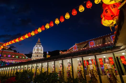Georgetown, Penang/Malaysia - Feb 20 2020: Buddha statue and pagoda during blue hour.