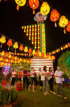 Georgetown, Penang/Malaysia - Feb 20 2020: Devotees light up lantern at Kek Lok Si temple.