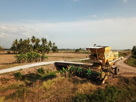 Pulau Sayak, Kedah/Malaysia - Feb 26 2020: Harvester park in paddy field.