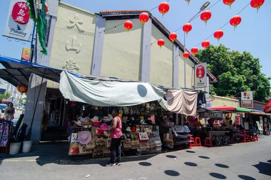 Georgetown, Penang/Malaysia - Feb 27 2020: Hat hawker at Lebuh Keng Kwee.