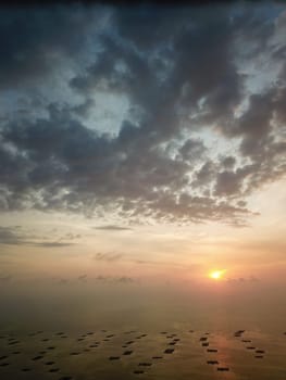 Batu Kawan, Penang/Malaysia - Feb 27 2020: Aerial fish farm during dramatic sunset.