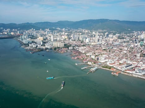 Georgetown, Penang/Malaysia - Feb 28 2020: Aerial view ferry move in different direction.