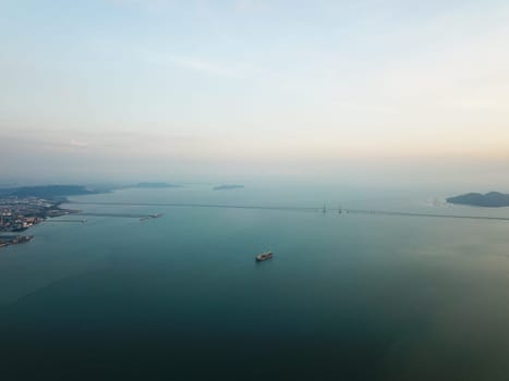 Georgetown, Penang/Malaysia - Feb 28 2020: Ship at Penang sea. Background is Penang Bridge.