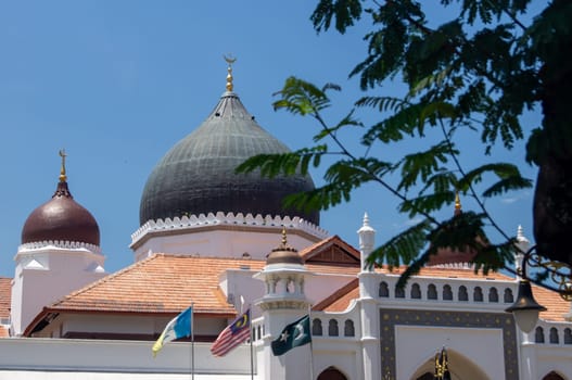 Georgetown, Penang/Malaysia - Feb 28 2020: Masjid Kapitan Keling Mosque with green leaves.