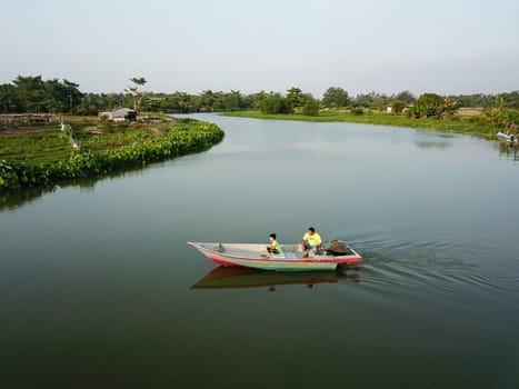 Local Malays family go to fishing with boat at Kampung Terus.