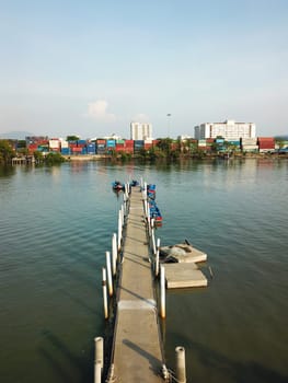 Perai, Penang/Malaysia - Mar 02 2020: Jetty at Bagan, Sungai Perai. Background is container depot.