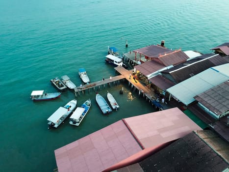 Georgetown, Penang/Malaysia - Feb 28 2020: Boat anchor near wooden bridge Chew Jetty.