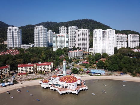 Georgetown, Penang/Malaysia - Mar 03 2020: Aerial view floating mosque and the development construction at Tanjung Bungah.