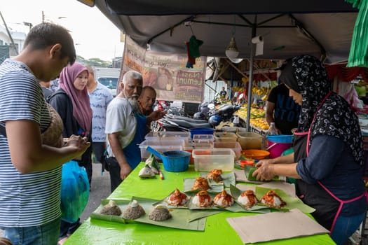 Bukit Mertajam, Penang/Malaysia - Mar 08 2020: People buy nasi lemak in pasar pagi.