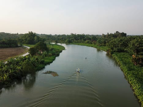 Penanti, Penang/Malaysia - Mar 01 2020: Aerial view boats move at Sungai Perai near rural area.