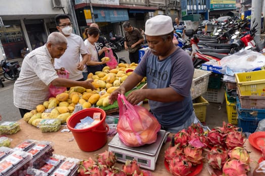 Bukit Mertajam, Penang/Malaysia - Mar 08 2020: Merchant sell fruit in Malaysia morning market.