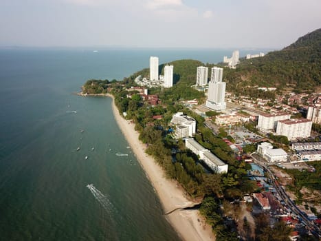 Teluk Bahang, Penang/Malaysia - Mar 08 2020: Aerial view boat sail at Batu Feringghi beach.