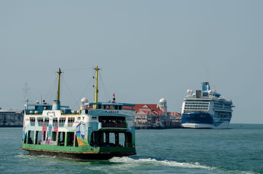 Georgetown, Penang/Malaysia - Feb 27 2020: Ferry move at sea. Background is pier Swettenham.