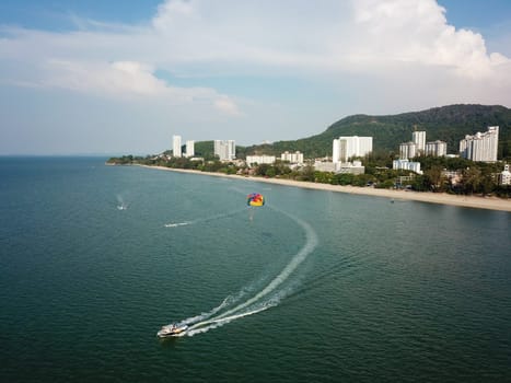 Batu Feringghi, Penang/Malaysia - Mar 08 2020: Parasailing at sea. Aerial view.