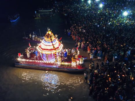Teluk Bahang, Penang/Malaysia - Mar 08 2020: Floating Chariot with light at beach during festival at Sri Singamuga Kaliamman Temple