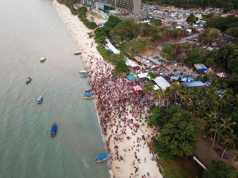 Teluk Bahang, Penang/Malaysia - Mar 08 2020: Aerial view Indian devotees at Masi Magam Theppa Thirunal (Floating Chariot Festival) at Sri Singamuga Kaliamman Temple