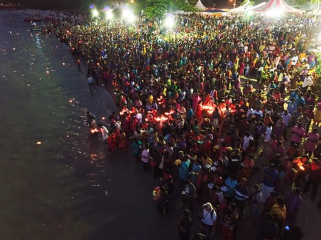 Teluk Bahang, Penang/Malaysia - Mar 08 2020: Devotees release eco friendly lamp in to sea at Sri Singamuga Kaliamman Temple