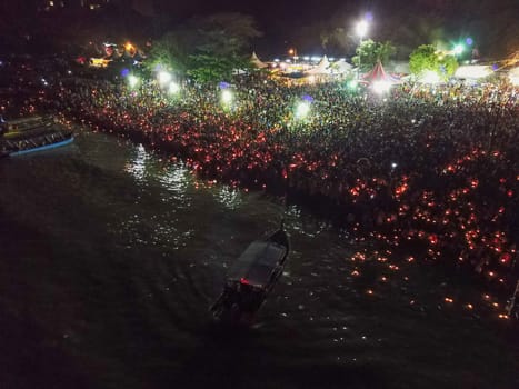 Teluk Bahang, Penang/Malaysia - Mar 08 2020: Thousand of devotees release lamp to sea during floating chariot festival