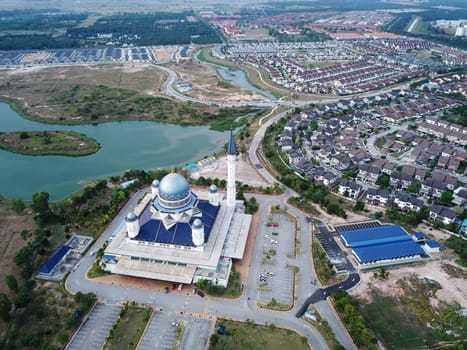 Kepala Batas, Penang/Malaysia - Mar 15 2020: Aerial view Masjid Abdullah Fahim near housing estate and blue lake.