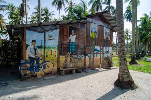 Malays Mural art at wooden hut in coconut farm.