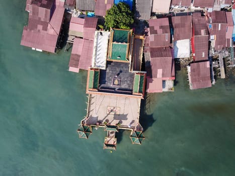 Georgetown, Penang/Malaysia - Mar 17 2020: Aerial look down Hean Boo Thean temple with wooden house at clan jetty.