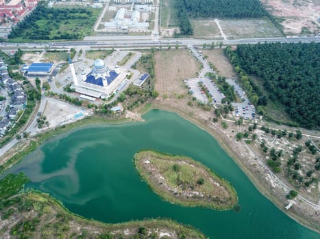 Kepala Batas, Penang/Malaysia - Mar 15 2020: Drone view Abdullah Fahim Mosque with green lake beside.